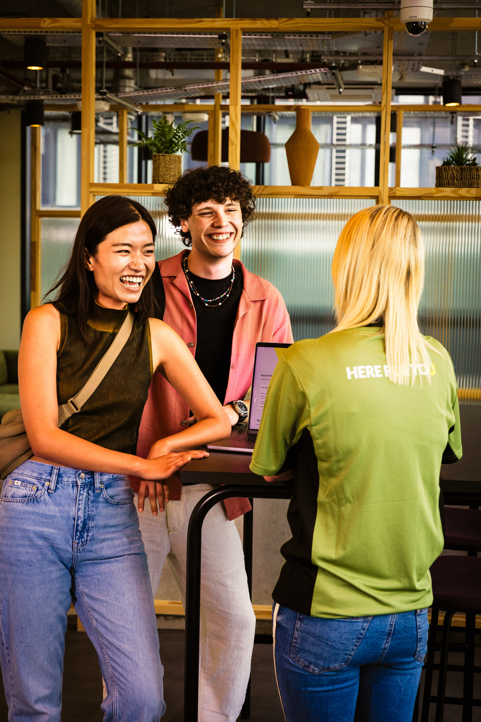 Students talking with a staff member.