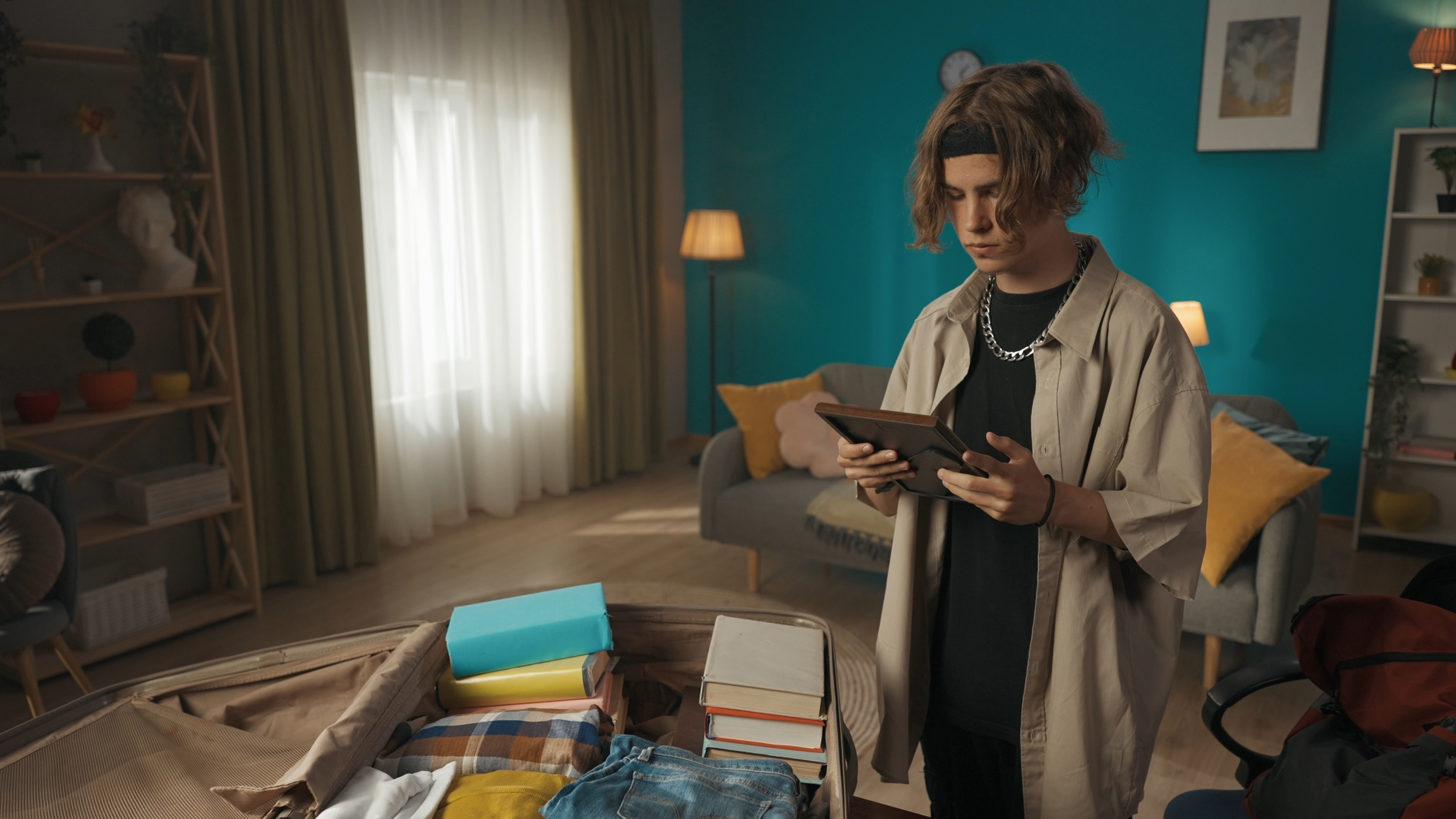 Person with boxes holding a letter
