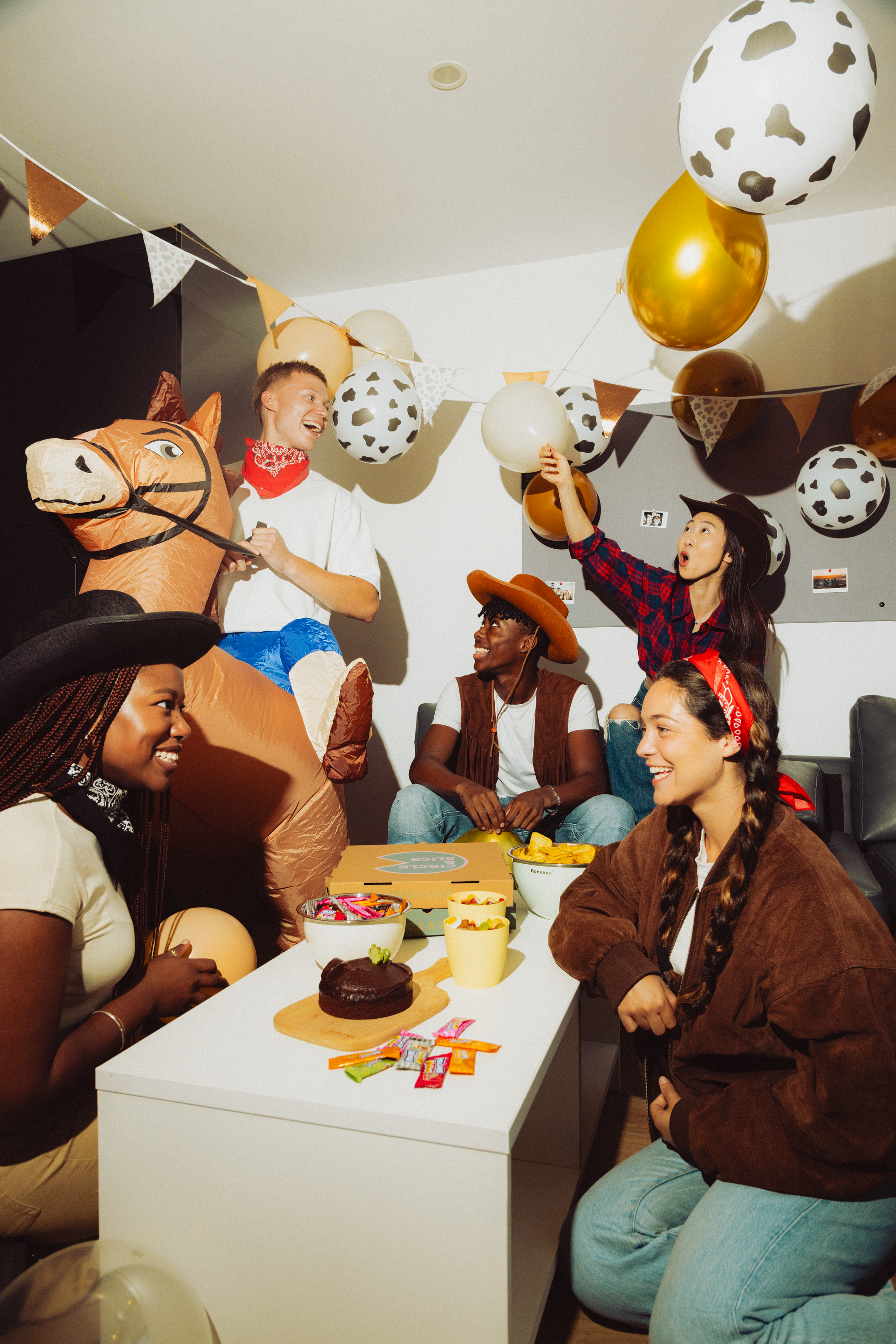 Students partying in a kitchen