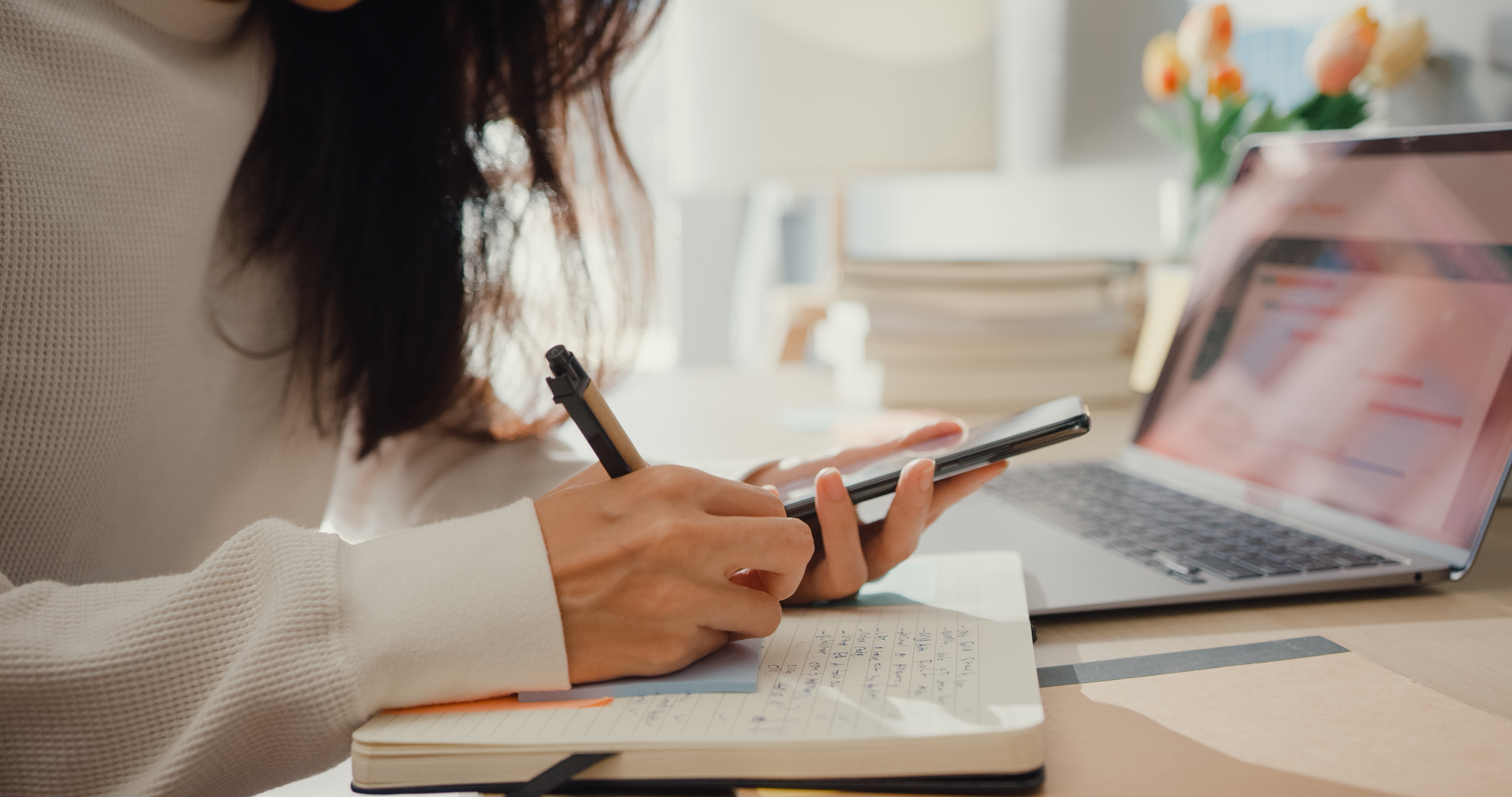 Photo of girl writing in notebook