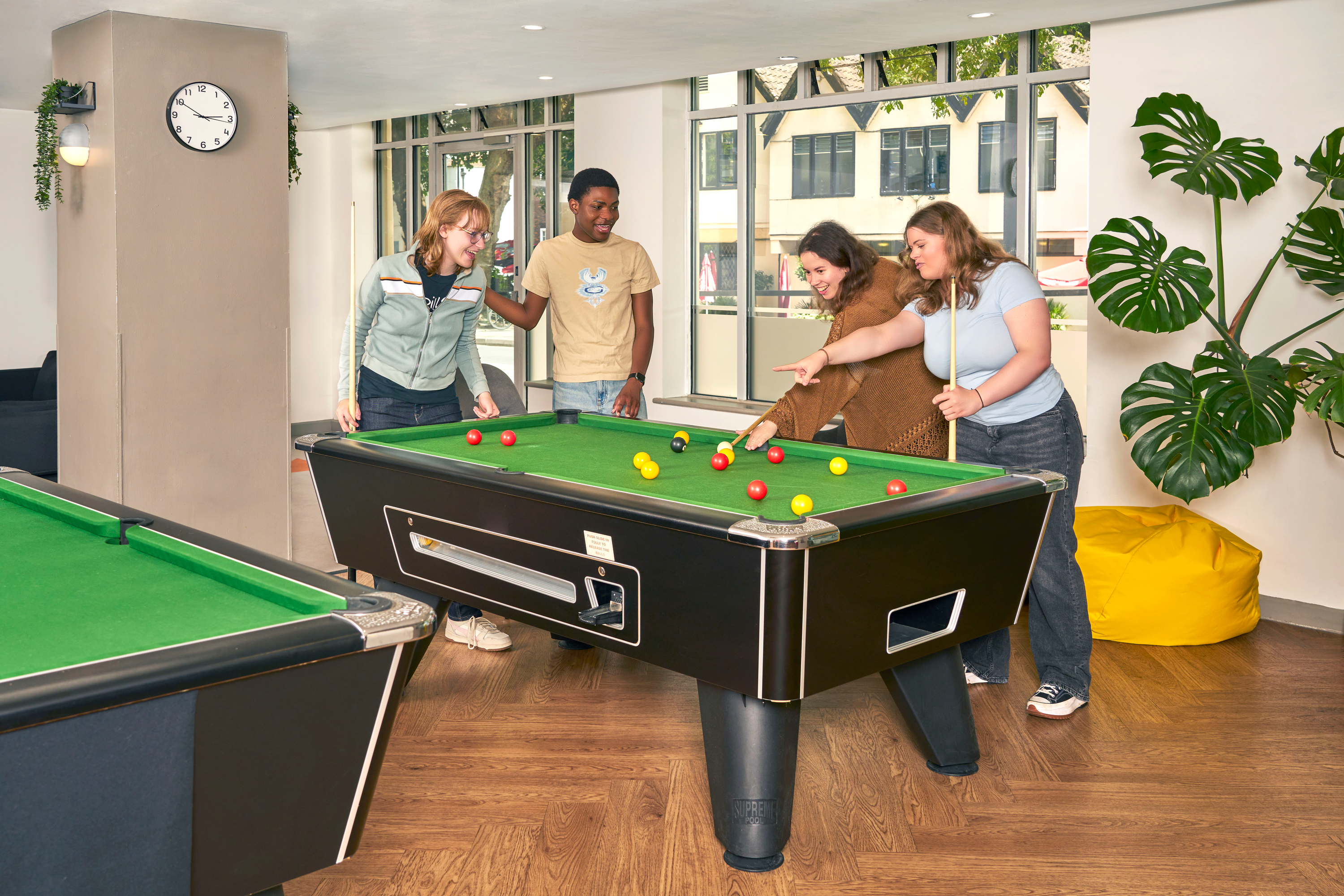 Students playing in the games area