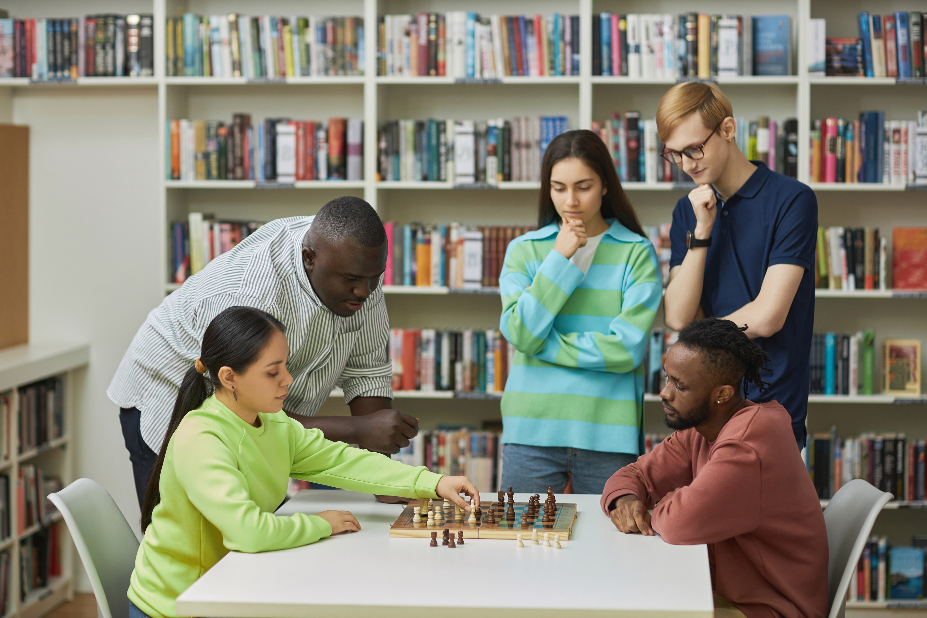 People playing chess and people watching