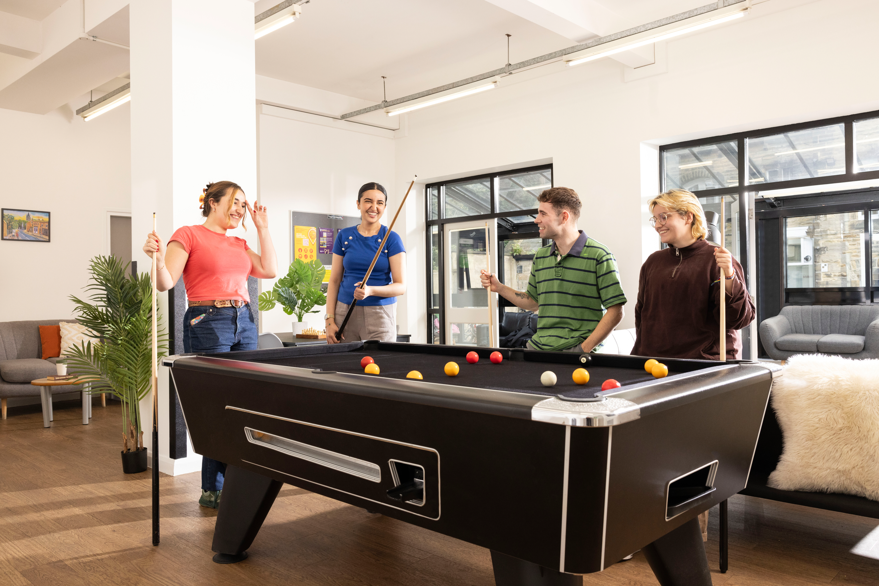 Students playing pool