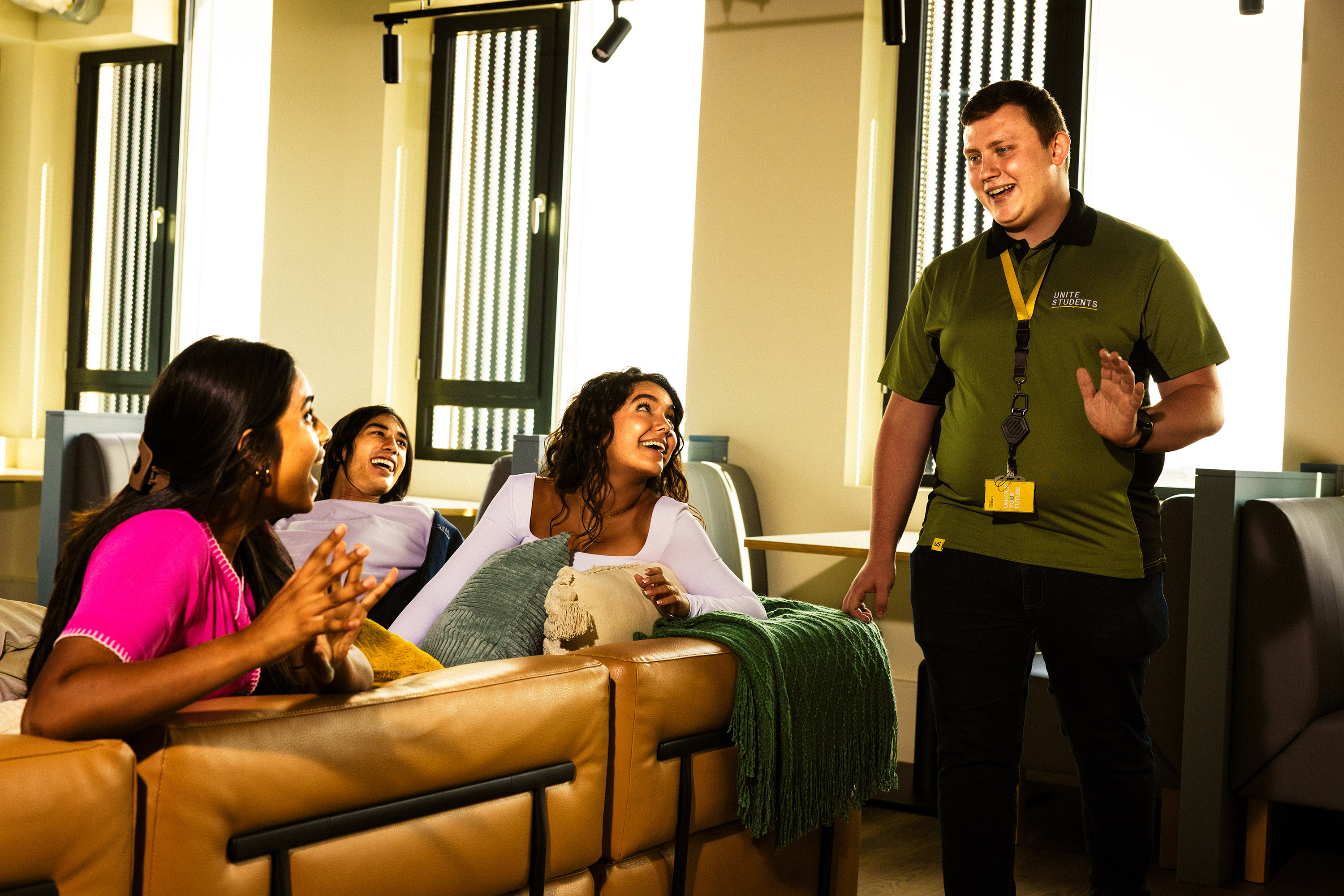Students greeting a member of US Staff